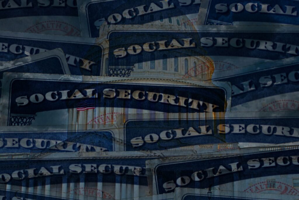 A layered collage of multiple Social Security cards blended over an image of the U.S. Capitol building, creating a visual theme connecting government institutions with Social Security benefits.
